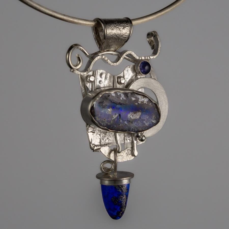 Silver pendant with blue stones