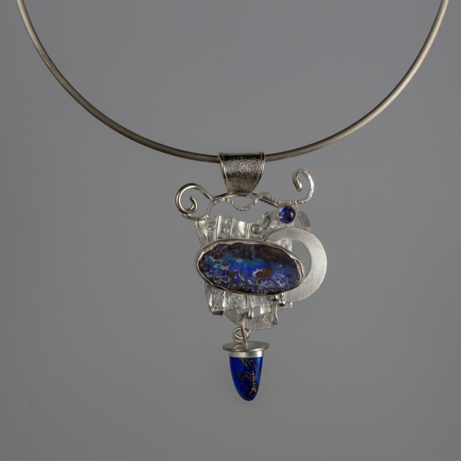 Silver pendant with blue stones