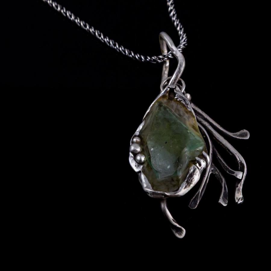 Silver pendant with green glass