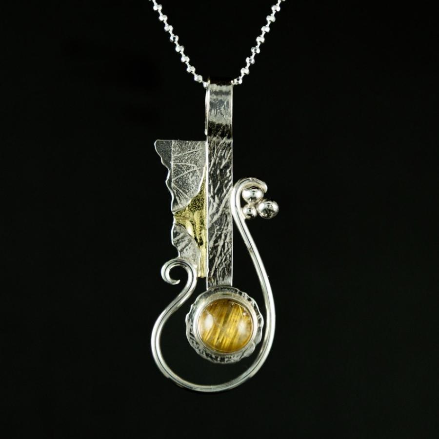 Pendant with silver, gold, and yellow stone