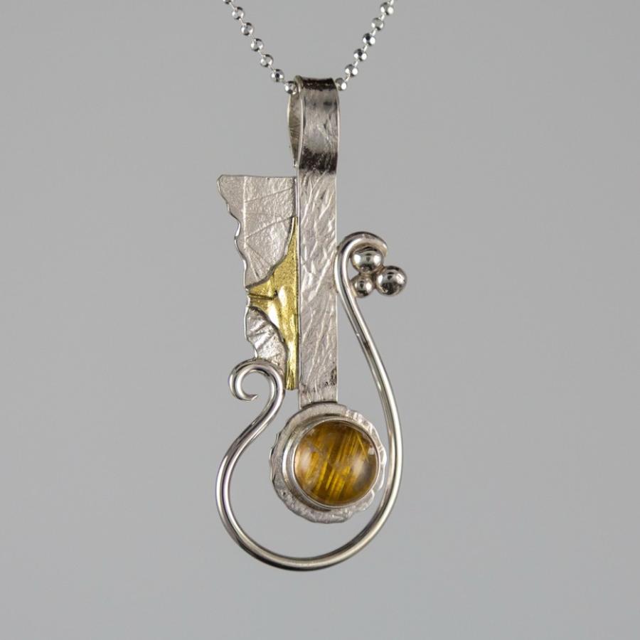 Pendant with silver, gold, and yellow stone