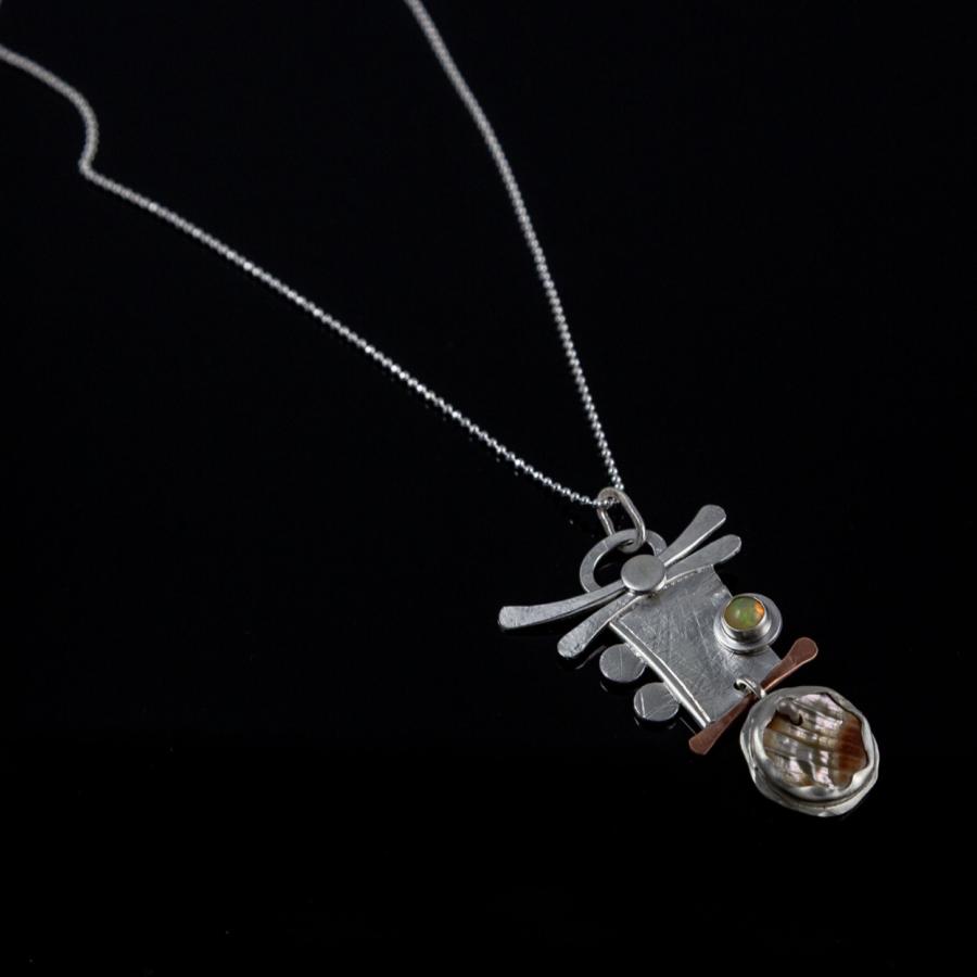 Silver and copper pendant with stones