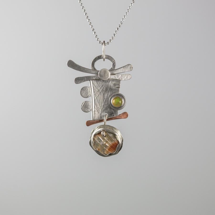 Silver and copper pendant with stones