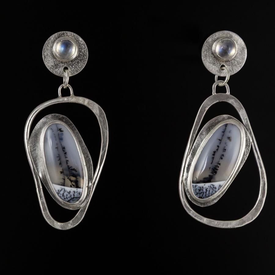 Silver earrings with a black and white stones