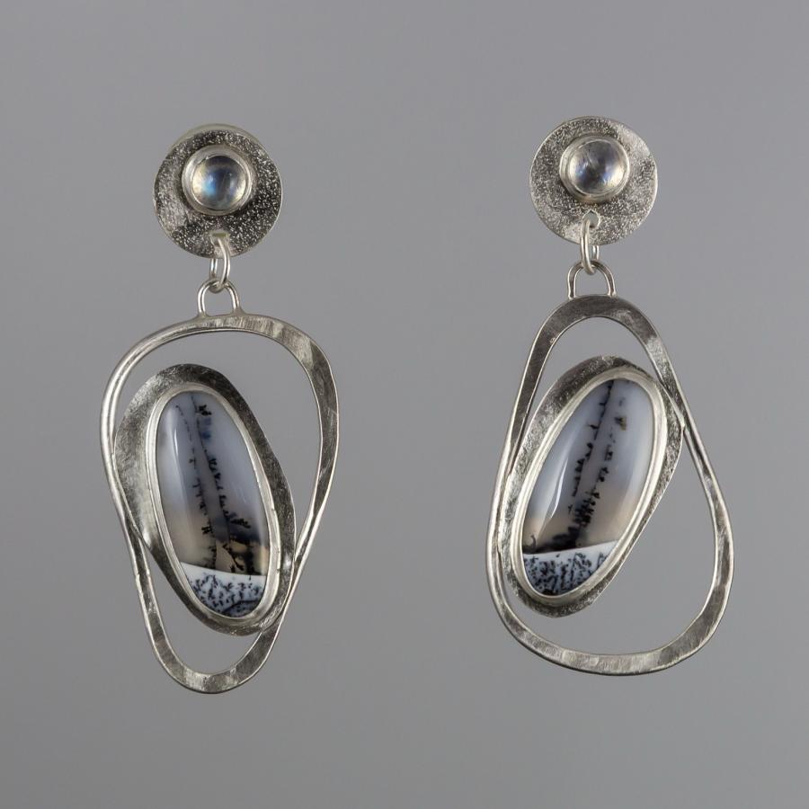 Silver earrings with a black and white stones
