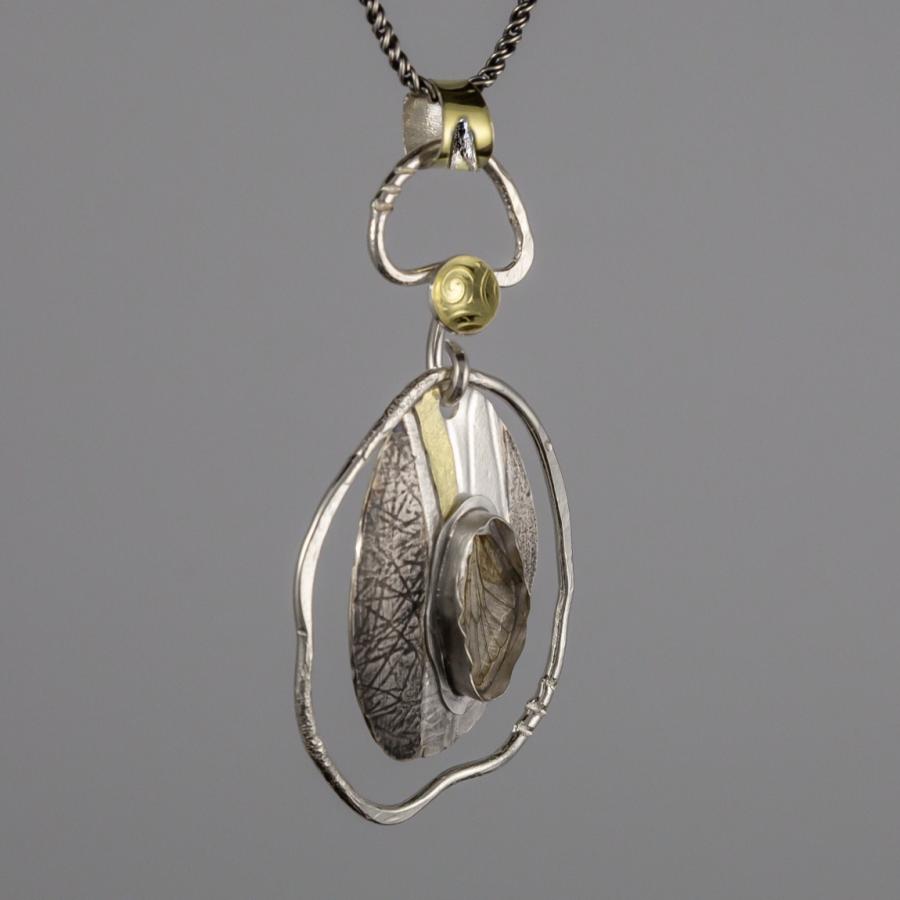 Pendent with silver, gold and insect wing