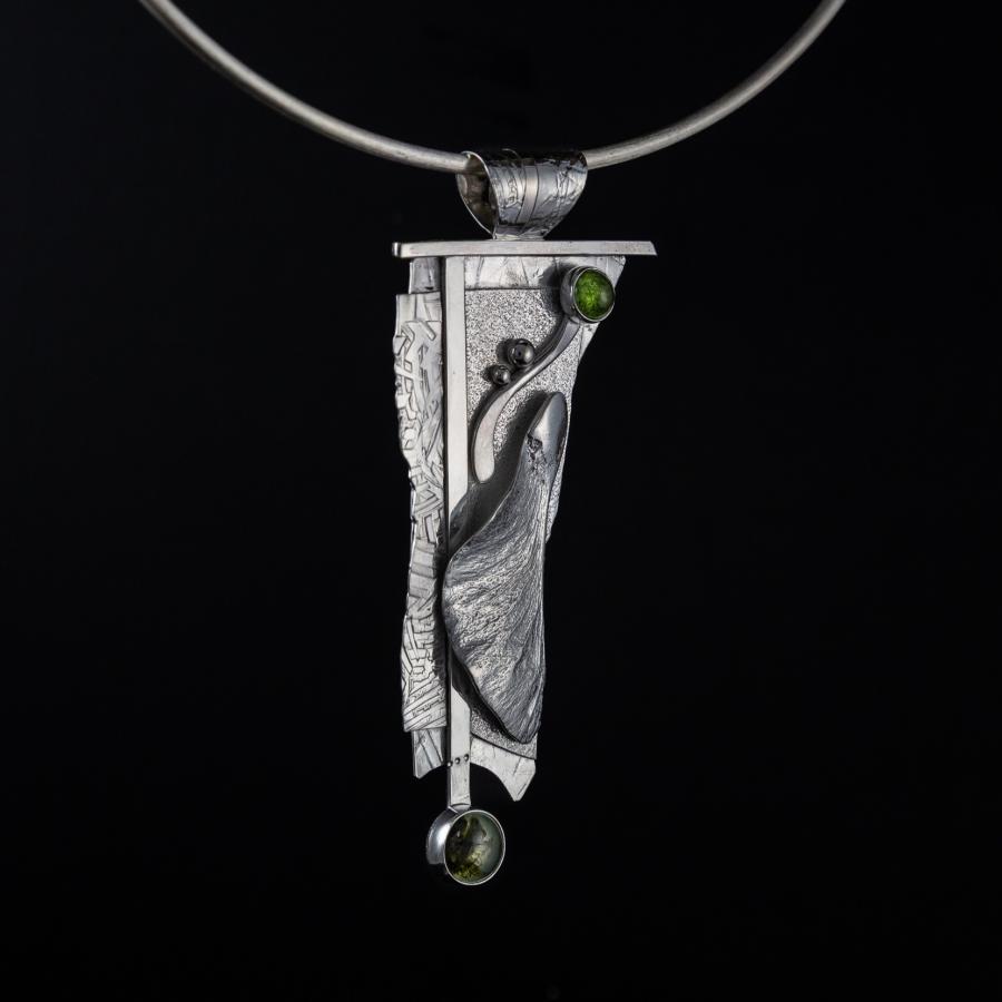 Silver pendant with green stones