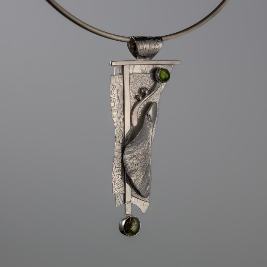 Silver pendant with green stones