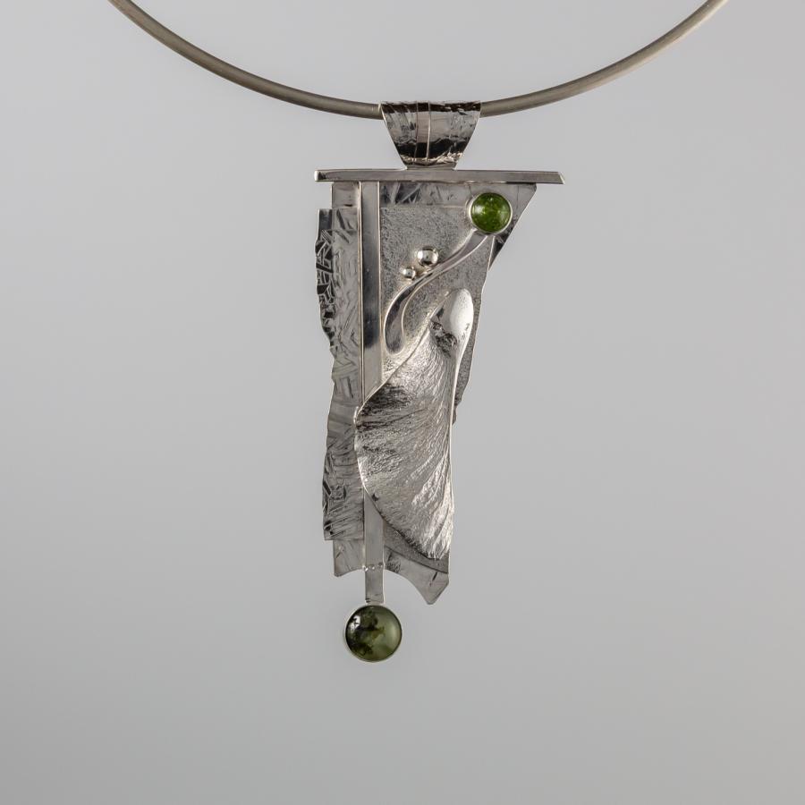 Silver pendant with green stones