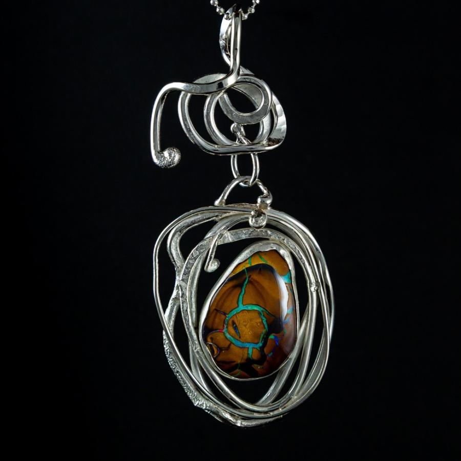 Silver pendant with boulder opal
