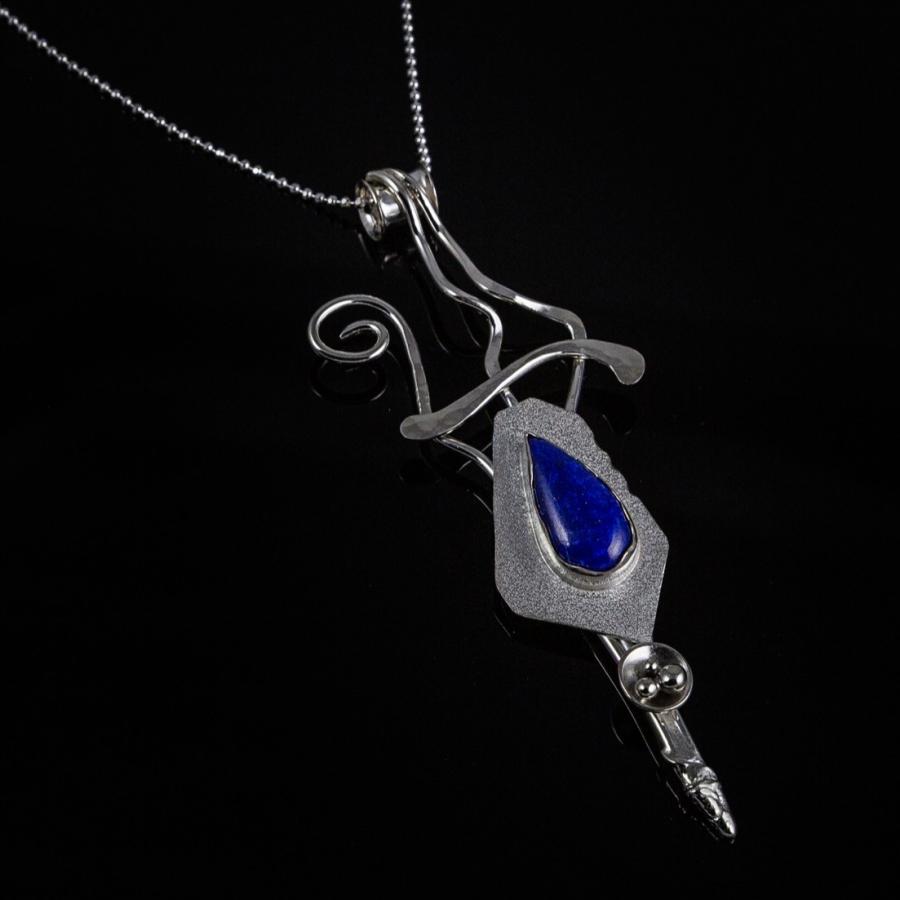Silver pendant with dark blue stone