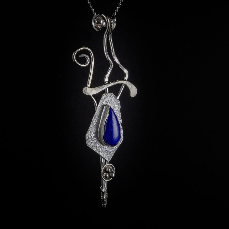 Silver pendant with dark blue stone