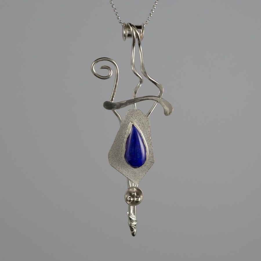 Silver pendant with dark blue stone