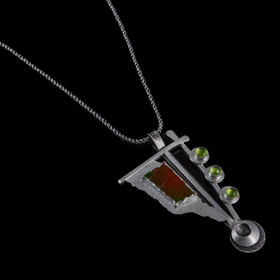 Silver pendant with several stones