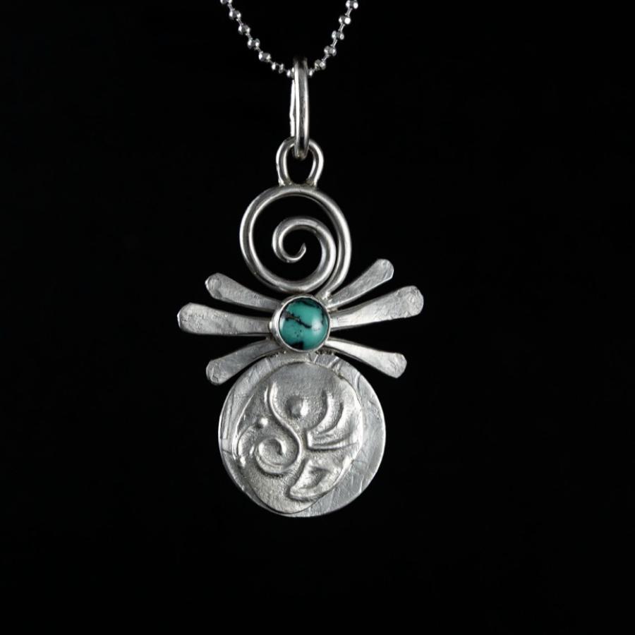 Silver pendant with turquoise stone