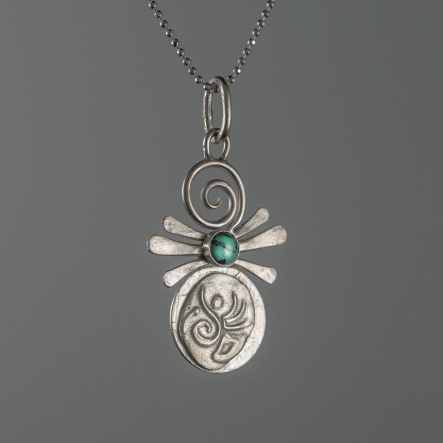 Silver pendant with turquoise stone