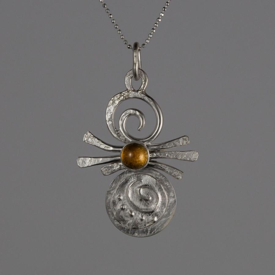 Silver pendant with yellow stone