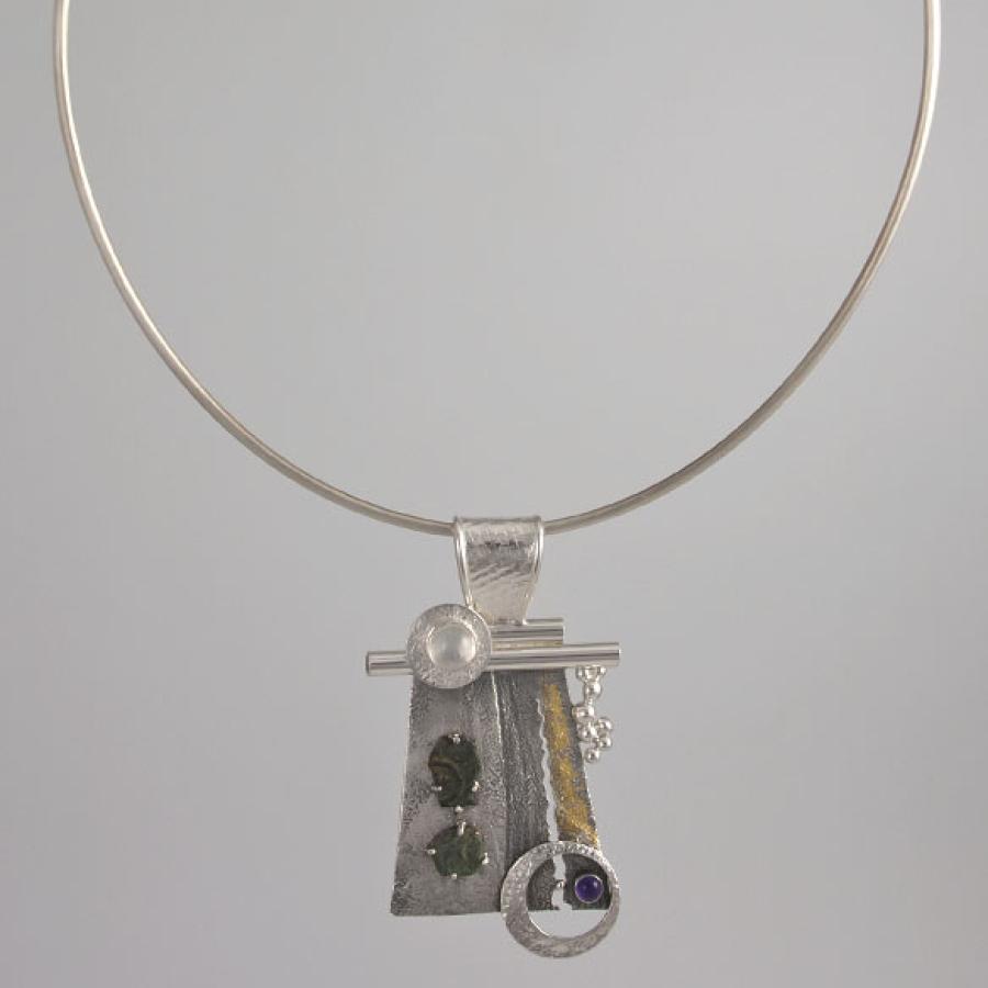 Necklace with silver pendant, gems and shapes.