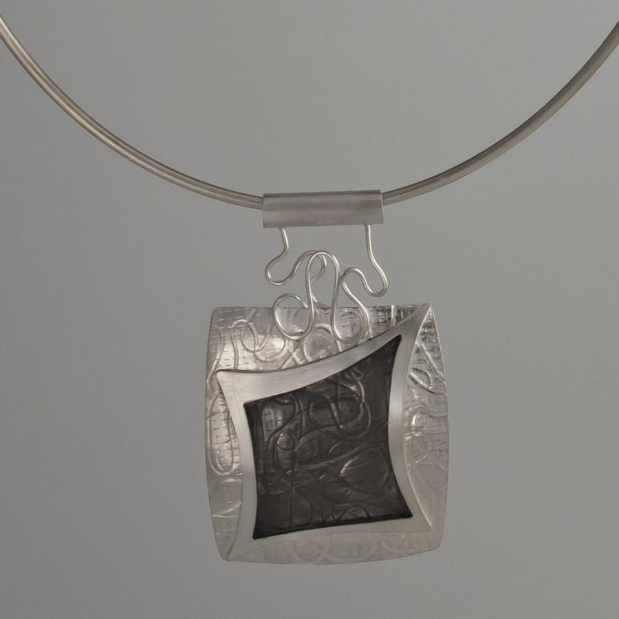 Silver pendant necklace.