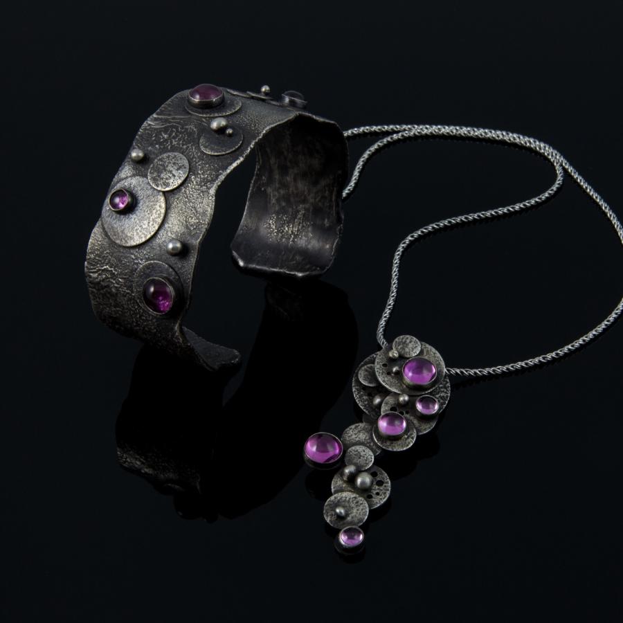 Handmade silver bracelet and necklace with pink stones.
