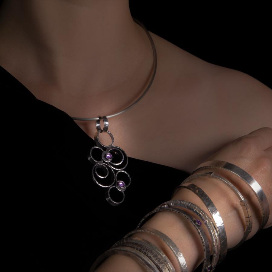 Close-up of a person wearing jewelry.