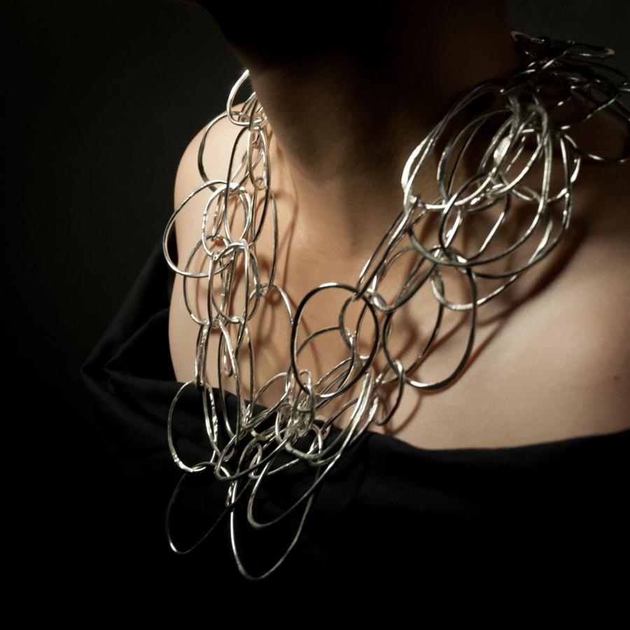 Woman with a silver necklace.