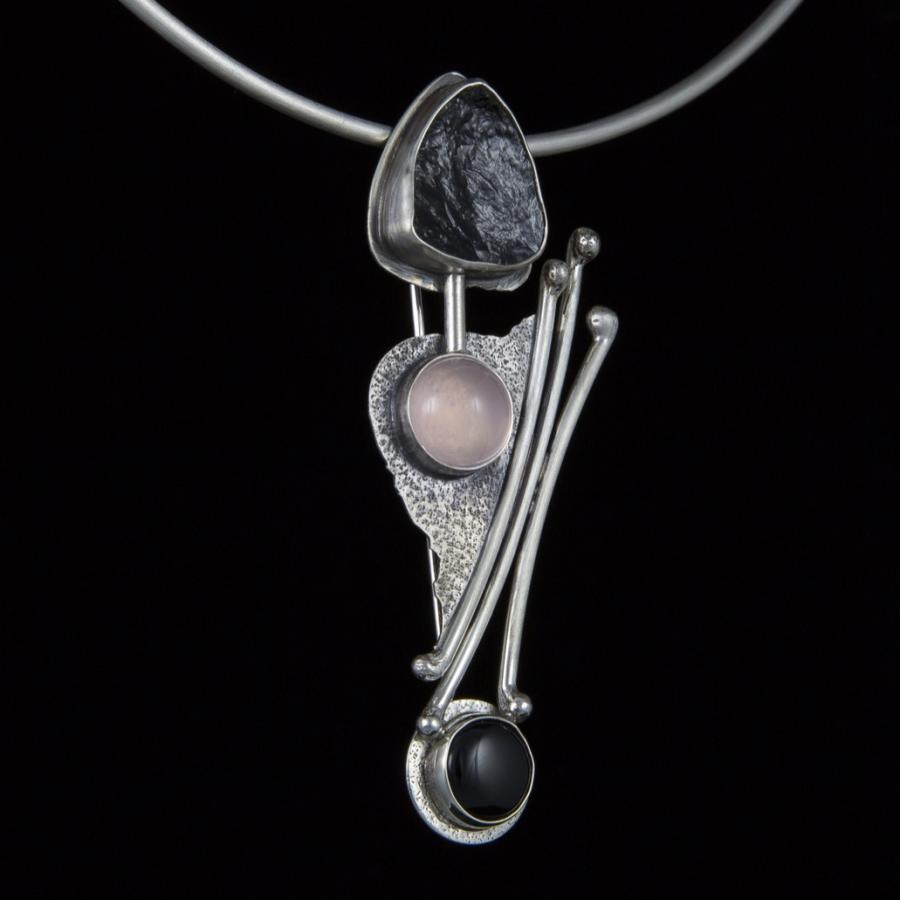 Handmade silver pendant with three stones.