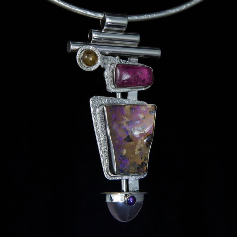 Silver necklace with colorful stones.