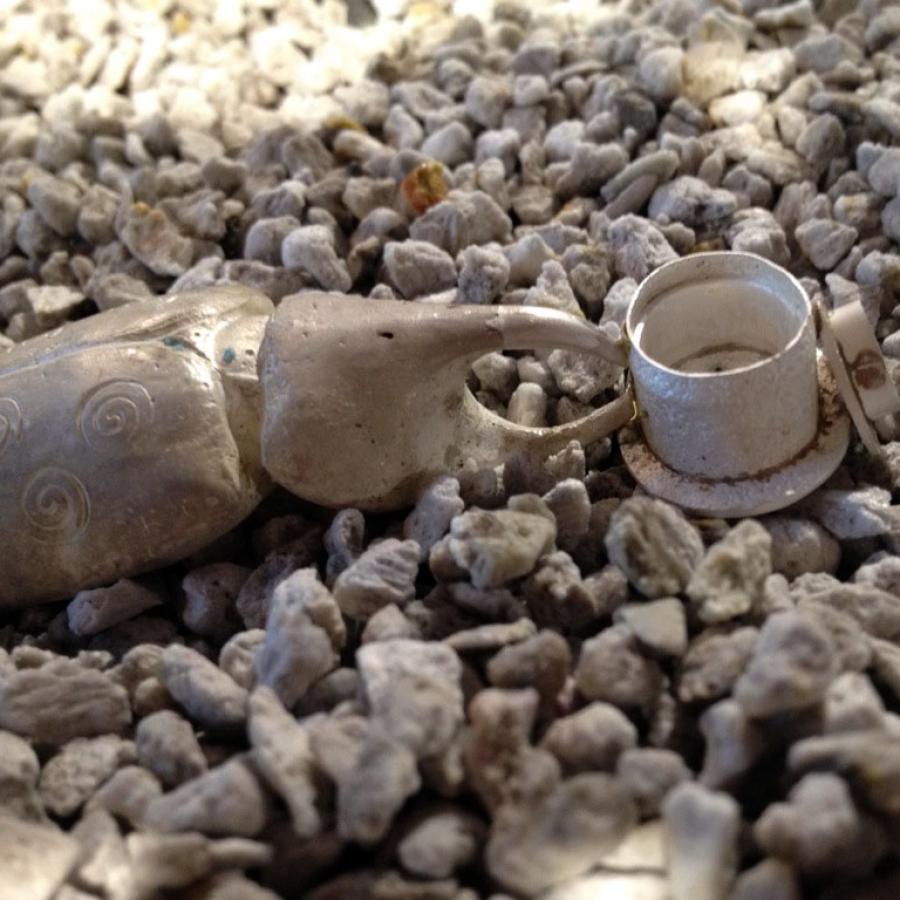 Silver components staged for soldering in pumice.