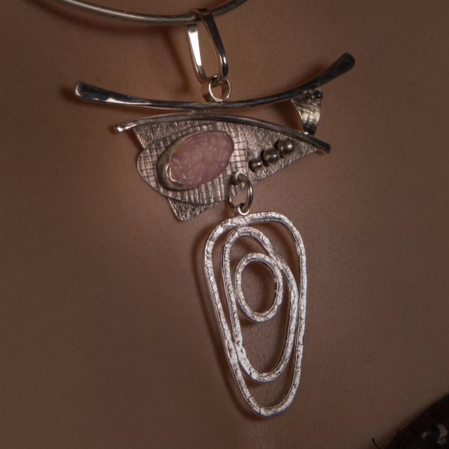 Woman wearing an elaborate necklace.