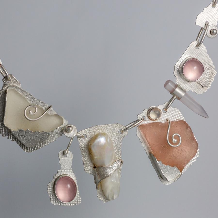 Handmade necklace of silver and rose quartz.