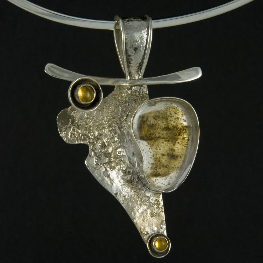 Silver necklace with abstract pendant.