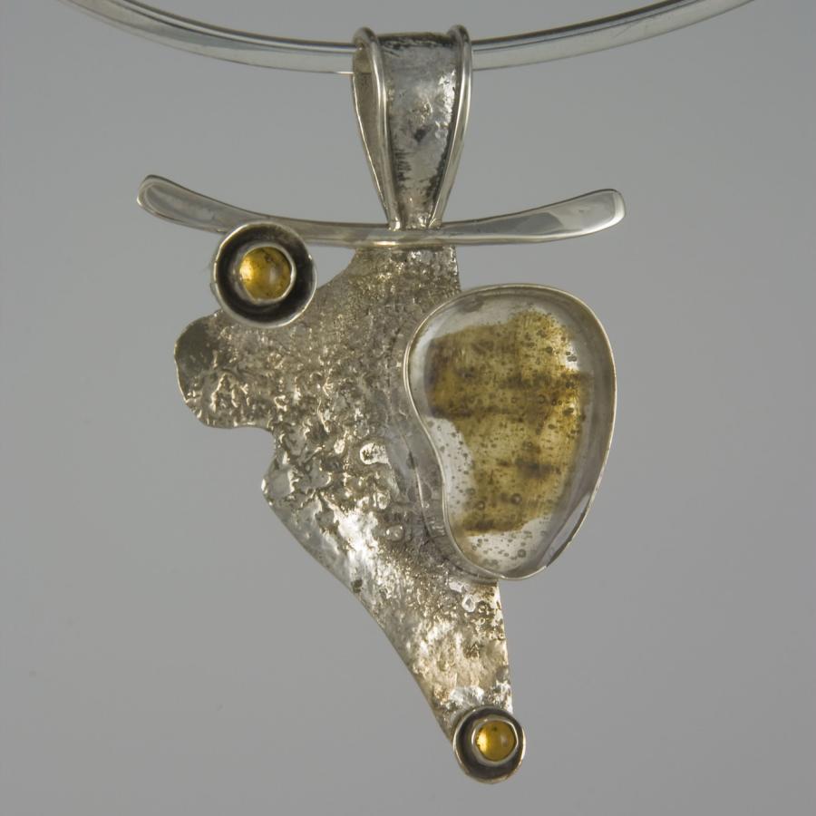 Silver necklace with abstract pendant.