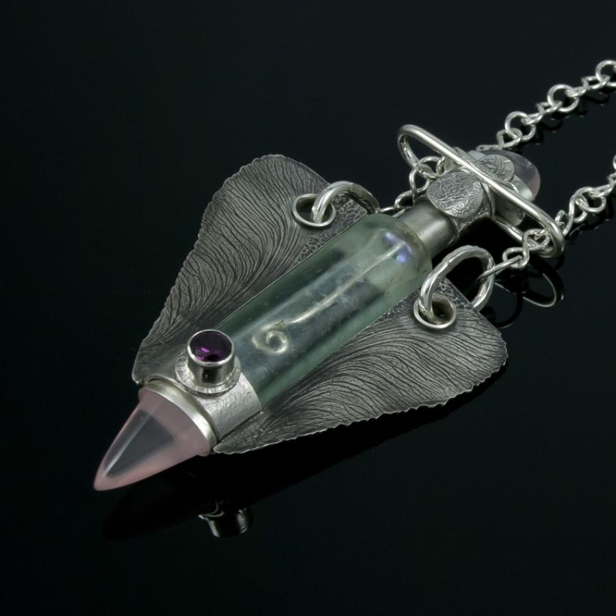 Silver necklace with glass bottle, stones.