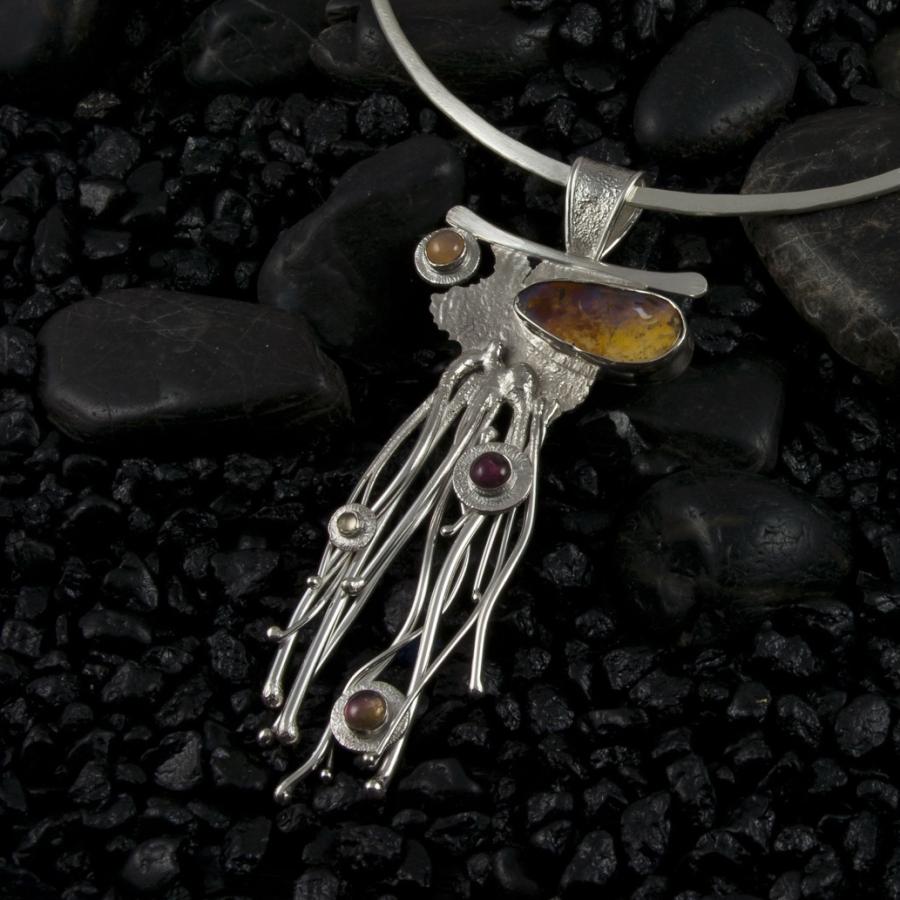 Necklace with opal and silver pendant.