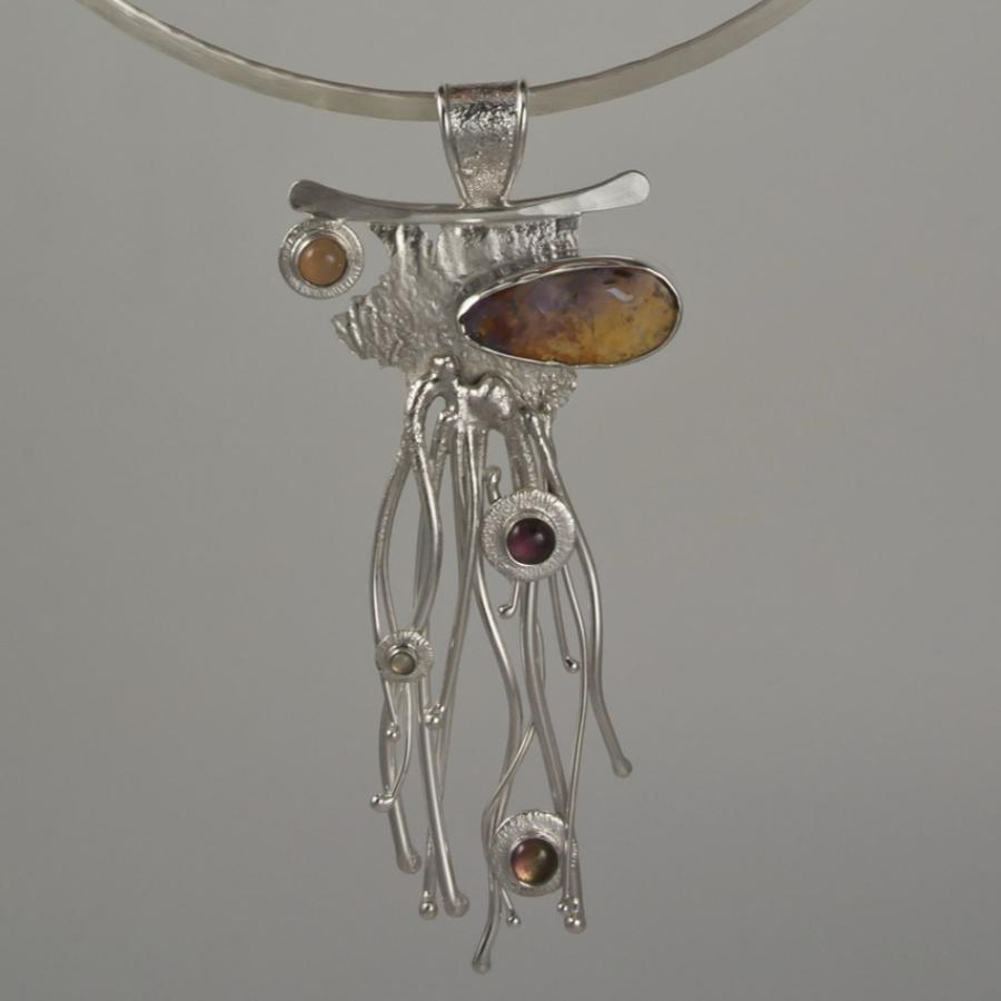 Necklace with opal and silver pendant.