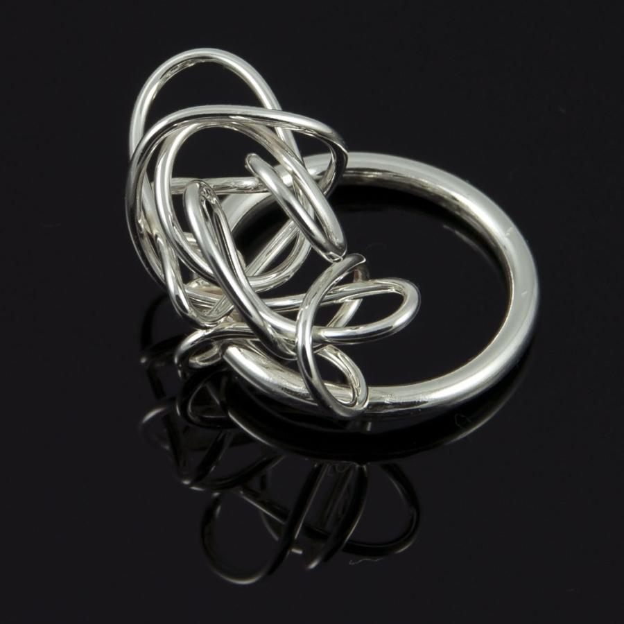 Photograph of a silver tangled ring.