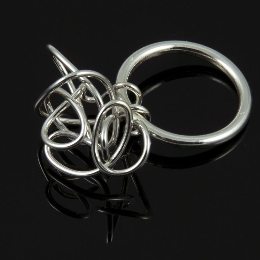 Photograph of a silver tangled ring.