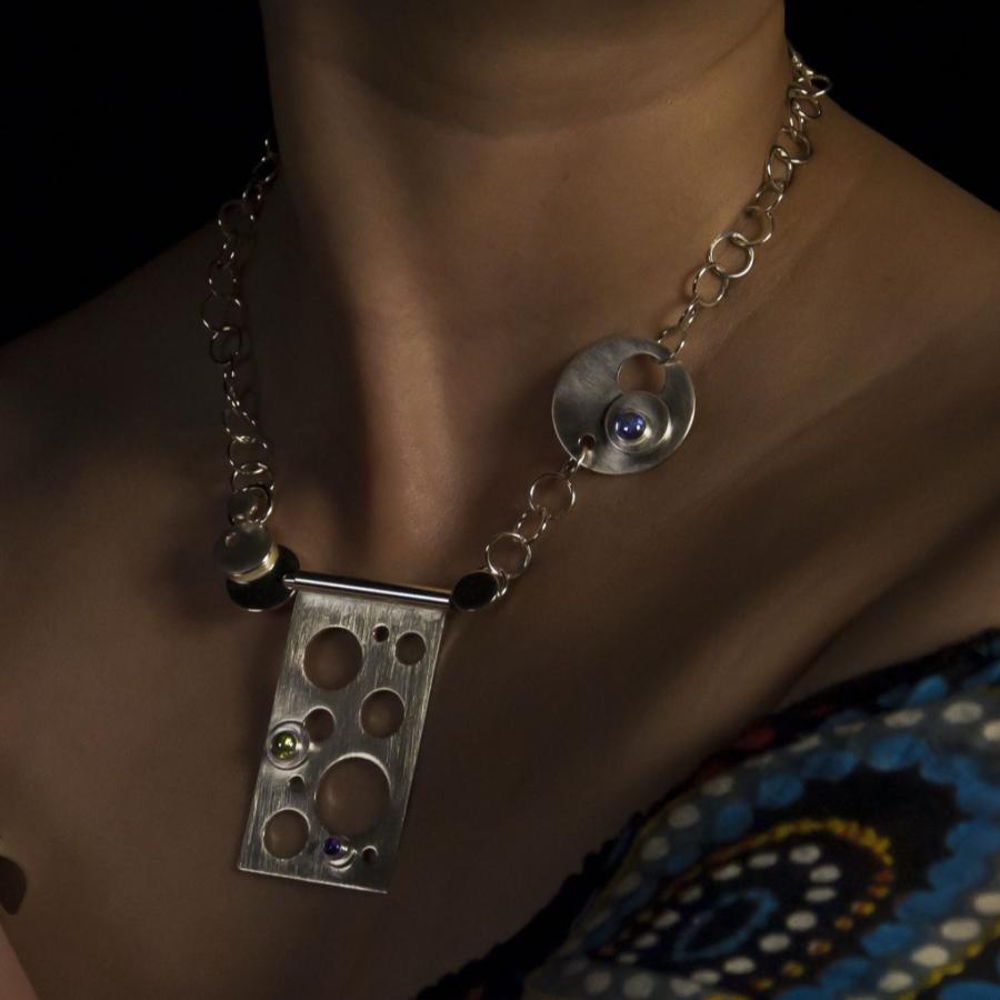 Woman modeling jewelry, necklace and bracelet.