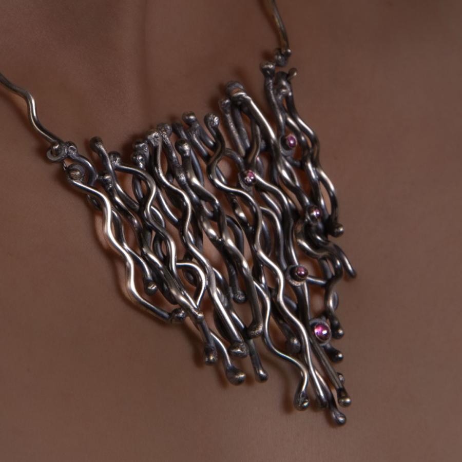 Necklace on a person.