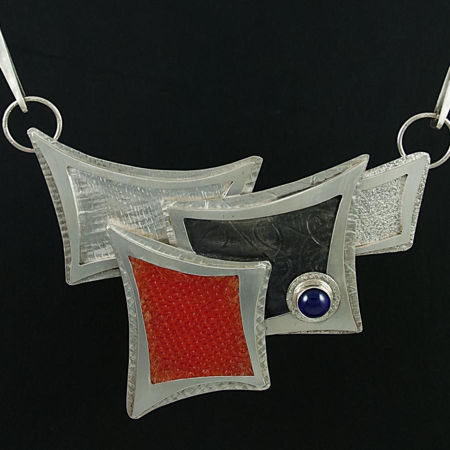 Handmade necklace, silver chain with geometric colored shapes.