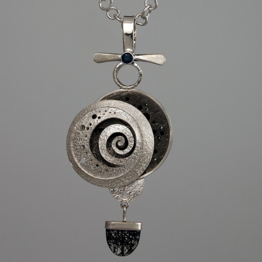 Silver necklace with spiral pendant.