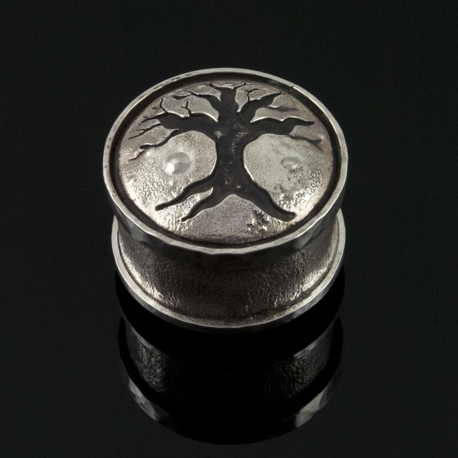 Small silver box with tree graphic on lid.