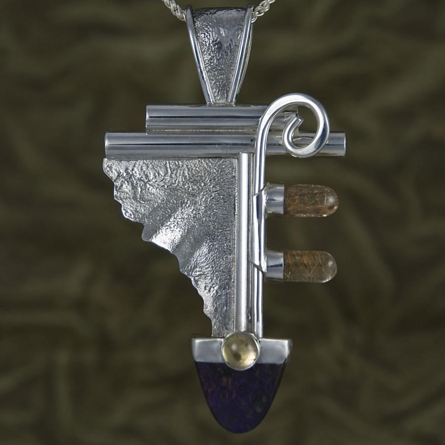 Silver pendant necklace with abstract design.