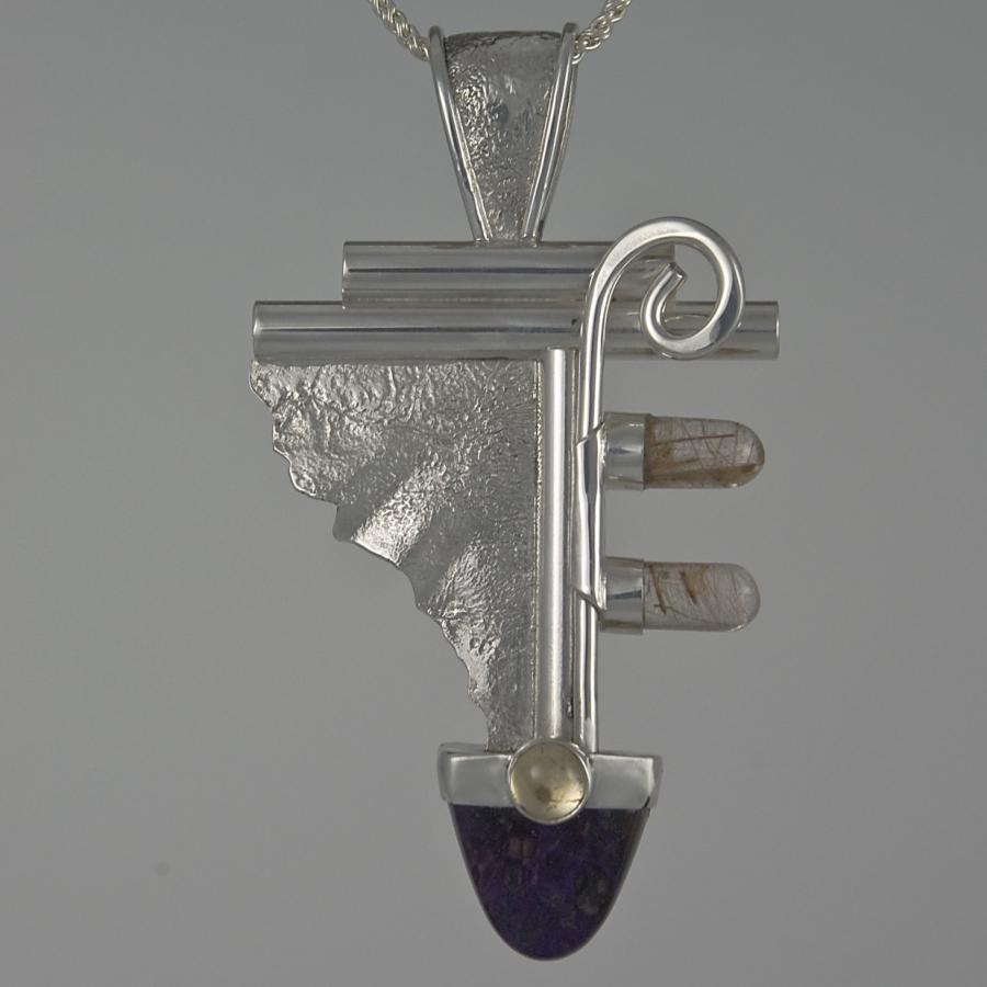 Necklace featuring an abstract pendant.