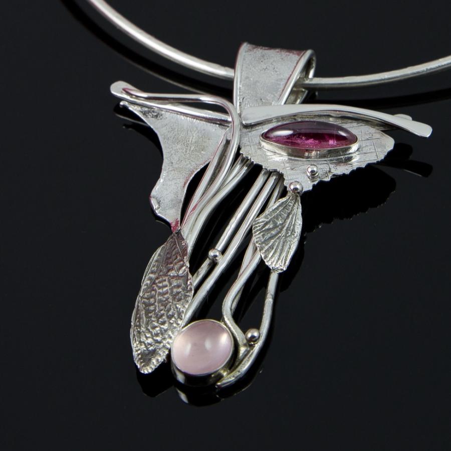 Silver necklace pink and purple stones.