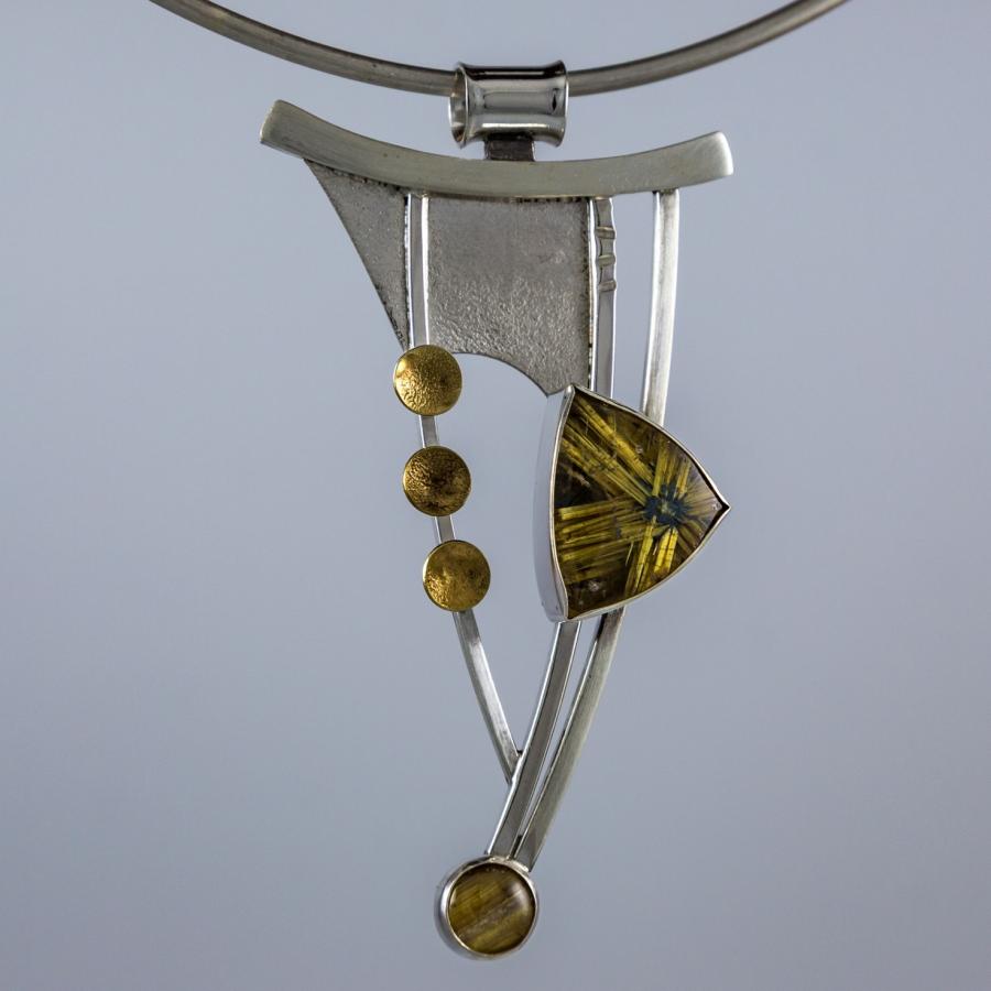 Handmade silver and gold pendant necklace.