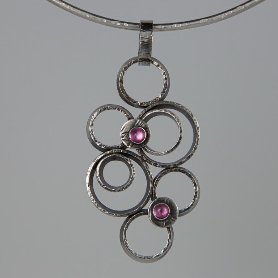 Silver circle pendant necklace.