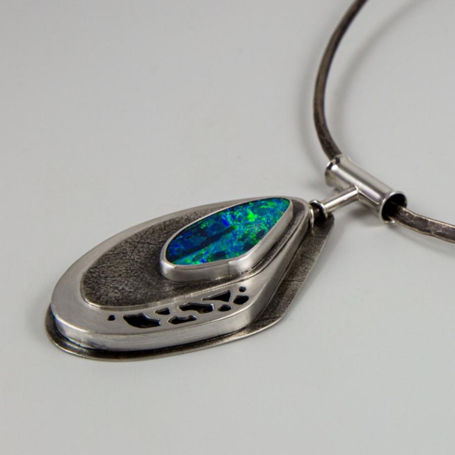 Necklace with silver pendant and blue-green opal.
