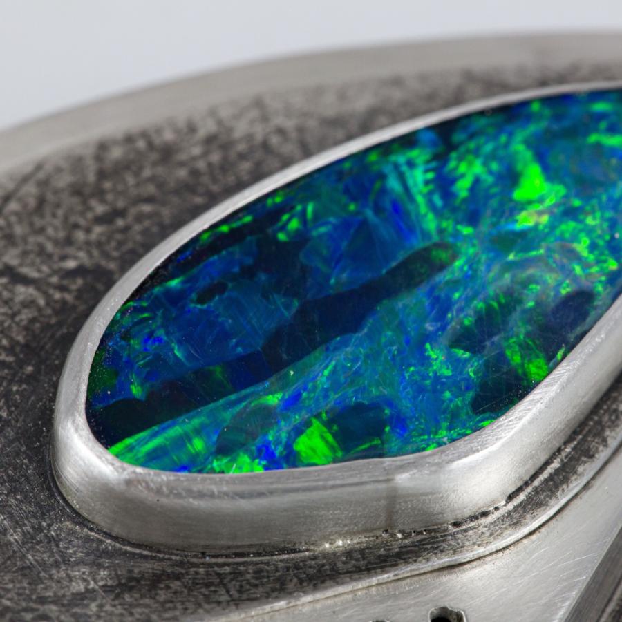 Close-up photograph of an opal pendant.